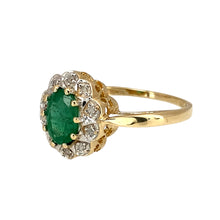 Load image into Gallery viewer, Add a touch of elegance and colour to your jewellery collection with this pre-owned 9ct yellow gold diamond &amp; emerald set cluster ring, featuring:

Design: A timeless cluster ring, showcasing a vibrant emerald surrounded by sparkling diamonds for a classic and sophisticated look.
Material: 9-carat yellow gold, with the stones set in white gold to enhance their brilliance.
Gemstones: Features a 7mm by 5mm emerald, complemented by diamond accents for added sparkle.

