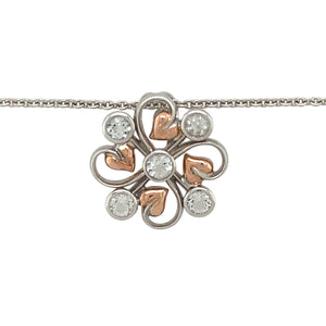 Preowned 925 Silver with 9ct Rose Gold Clogau & White Topaz Set Tree of Life Pendant on an 18" - 22" Clogau curb chain with the weight 7.80 grams. The pendant is 2.3cm diameter and the topaz stones are each approximately 3mm diameter