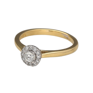 Preowned 18ct Yellow and White Gold & Diamond Set Halo Solitaire Ring in size N with the weight 3.30 grams. There is approximately 25pt of diamond content in total with approximate clarity i1 and colour K - L