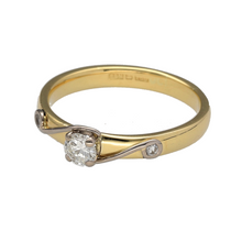 Load image into Gallery viewer, Preowned 18ct Yellow and White Gold &amp; Diamond Set Solitaire Ring in size M to N with the weight 3.40 grams. The ring has two smaller diamonds set in white gold on the band. There is approximately 25pt of diamond content set in total
