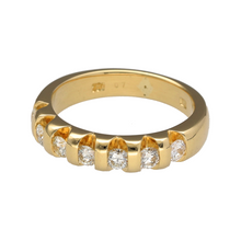 Load image into Gallery viewer, Preowned 18ct Yellow Gold &amp; Diamond Tension Set Band Ring in size N with the weight 6.90 grams. The front of the band is 5mm wide and there is approximately 70pt of diamond content in total. The ring is made up of seven brilliant cut tension set diamonds
