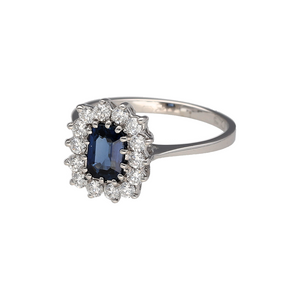 Preowned 18ct White Gold Diamond & Sapphire Set Cluster Ring in size K with the weight 2.80 grams. The front of the ring is 11mm high and the sapphire stone is 6mm by 4mm. There is approximately 42pt of diamond content in total