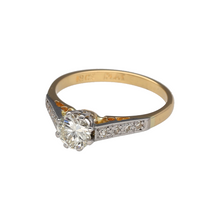 Load image into Gallery viewer, Preowned 18ct Yellow Gold &amp; Platinum Diamond Set Solitaire Ring in size M with the weight 2.80 grams. The shoulders are set with diamonds and the center diamond is approximately 66pt. The diamonds are approximate clarity VS2 and colour K - M
