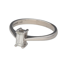 Load image into Gallery viewer, Preowned 18ct White Gold &amp; Diamond Set Emerald Cut Solitaire Ring in size M with the weight 3 grams. The diamond is approximately 66pt with approximate clarity VS and colour M - R
