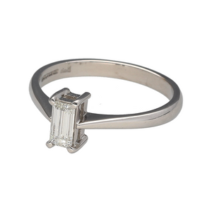 Preowned 18ct White Gold & Diamond Set Emerald Cut Solitaire Ring in size M with the weight 3 grams. The diamond is approximately 66pt with approximate clarity VS and colour M - R