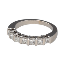 Load image into Gallery viewer, Preowned 18ct White Gold &amp; Diamond Set Band Ring in size K with the weight 4.70 grams. The ring is made up of seven princess cut diamonds with approximately 91pt of diamond content in total at approximate clarity Si. The band is approximately 4mm wide at the front
