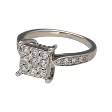 Load image into Gallery viewer, Preowned 18ct White Gold &amp; Diamond Princess Cut Illusion Set Solitaire Ring in size L with the weight 4.30 grams. The ring is made up of nine princess cut diamonds set together to give the impression of one stone which has approximately 50pt of diamond content set together in total plus diamonds set on the shoulders
