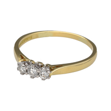 Load image into Gallery viewer, Preowned 18ct Yellow and White Gold &amp; Diamond Set Trilogy Ring in size T with the weight 2.80 grams. There is approximately 0.25ct of diamond content in total with approximate clarity i1
