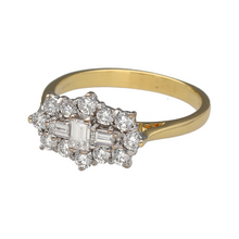 Load image into Gallery viewer, Preowned 18ct Yellow and White Gold &amp; Diamond Set Cluster Ring in size N to O with the weight 3.70 grams. There is approximately 0.70ct of diamond content set in total within the baguette and brilliant cut diamonds. The front of the ring is 10mm high
