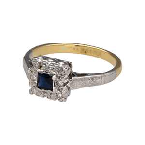 Preowned 18ct Yellow and White Gold Diamond & Sapphire Set Vintage Style Ring in size L with the weight 3.40 grams. The front of the ring is 8mm and the sapphire stone is approximately 3.5mm by 3.5mm