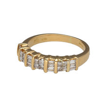 Load image into Gallery viewer, Preowned 18ct Yellow Gold &amp; Diamond Set Band Ring in size K with the weight 4 grams. The front of the band is 4mm wide. the band is made up of princess cut and baguette cut diamonds
