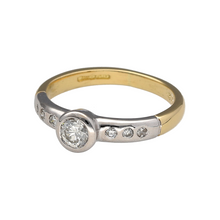 Load image into Gallery viewer, Preowned 18ct Yellow and White Gold &amp; Diamond Rubover Set Solitaire Ring in size I with the weight 3 grams. The diamond is approximately 0.33ct and in addition the shoulders are diamond set
