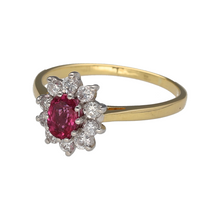 Load image into Gallery viewer, Add a timeless and elegant piece to your jewellery collection with this pre-owned 18ct yellow gold diamond &amp; ruby set cluster ring, featuring:

Design: A classic cluster ring, showcasing a vibrant ruby surrounded by sparkling diamonds for a sophisticated look.
Material: 18-carat yellow gold, with the stones set in white gold, enhancing their brilliance and contrast.
Gemstone: Features a 6mm by 4mm ruby, providing a rich and eye-catching focal point.

